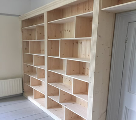 Made measure wall bookcase unit over door 