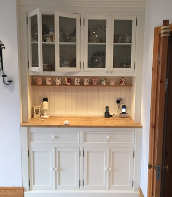 Built In Fitted Dresser With Glass Doors On Top Section.